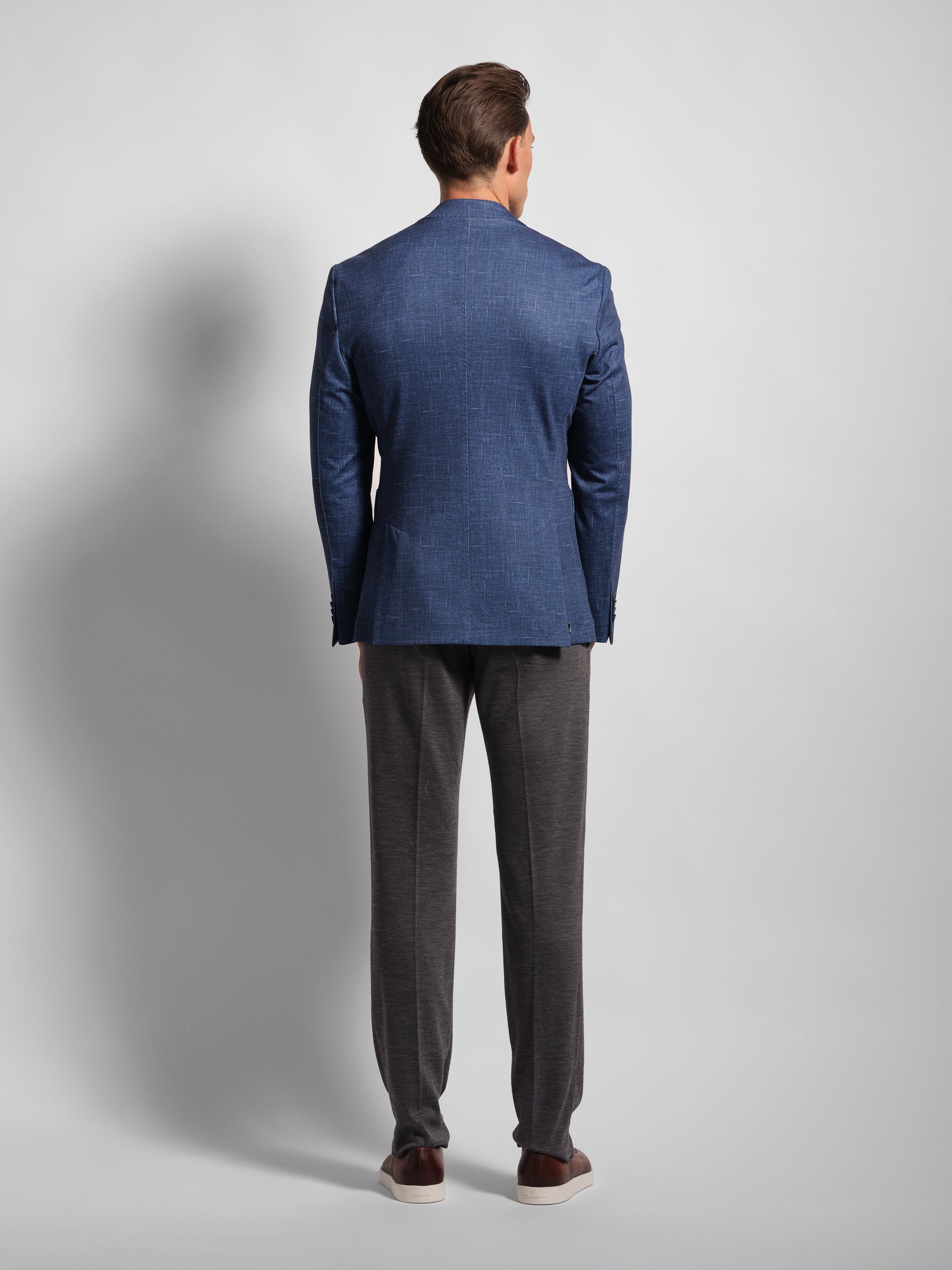 back of Man in a stretchy, comfortable Navy Jersey blazer over a white t-shirt with navy pants wearing Man Wears Sheep