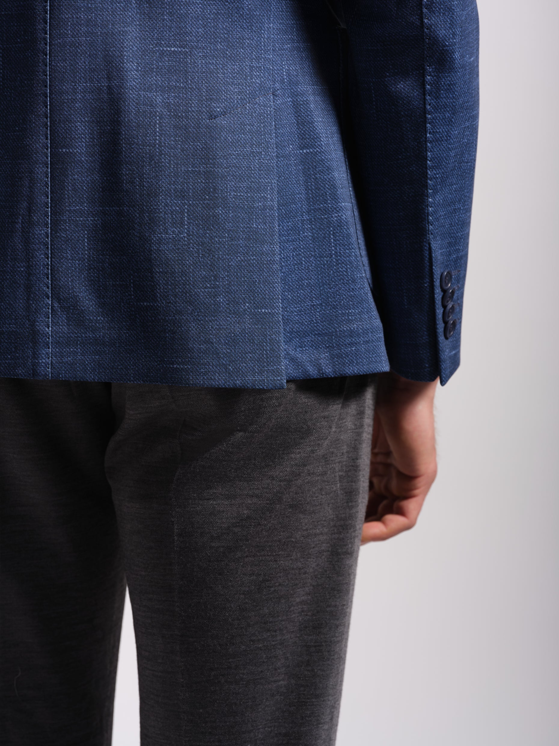 Man in a stretchy, comfortable Navy Jersey two vent blazer jacket over a white t-shirt with navy pants wearing Man Wears Sheep