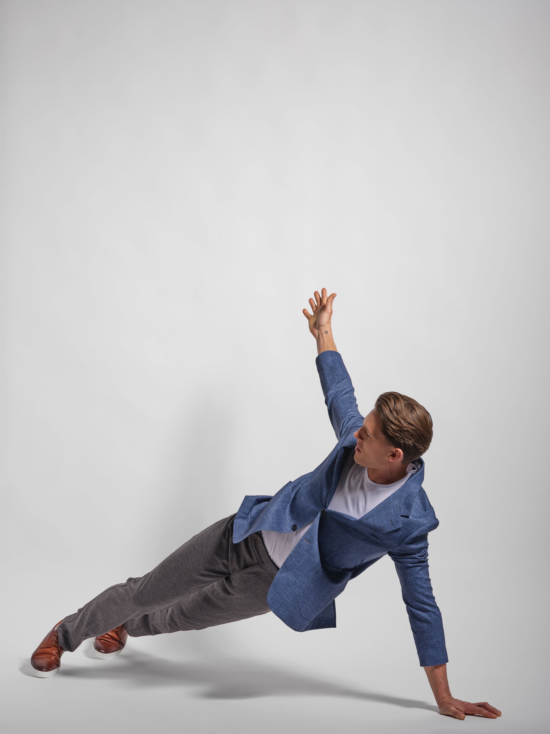 Man showing a stretchy, comfortable Navy Jersey 2-button blazer jacket over a white t-shirt with navy pants wearing, Man Wears Sheep, athletic