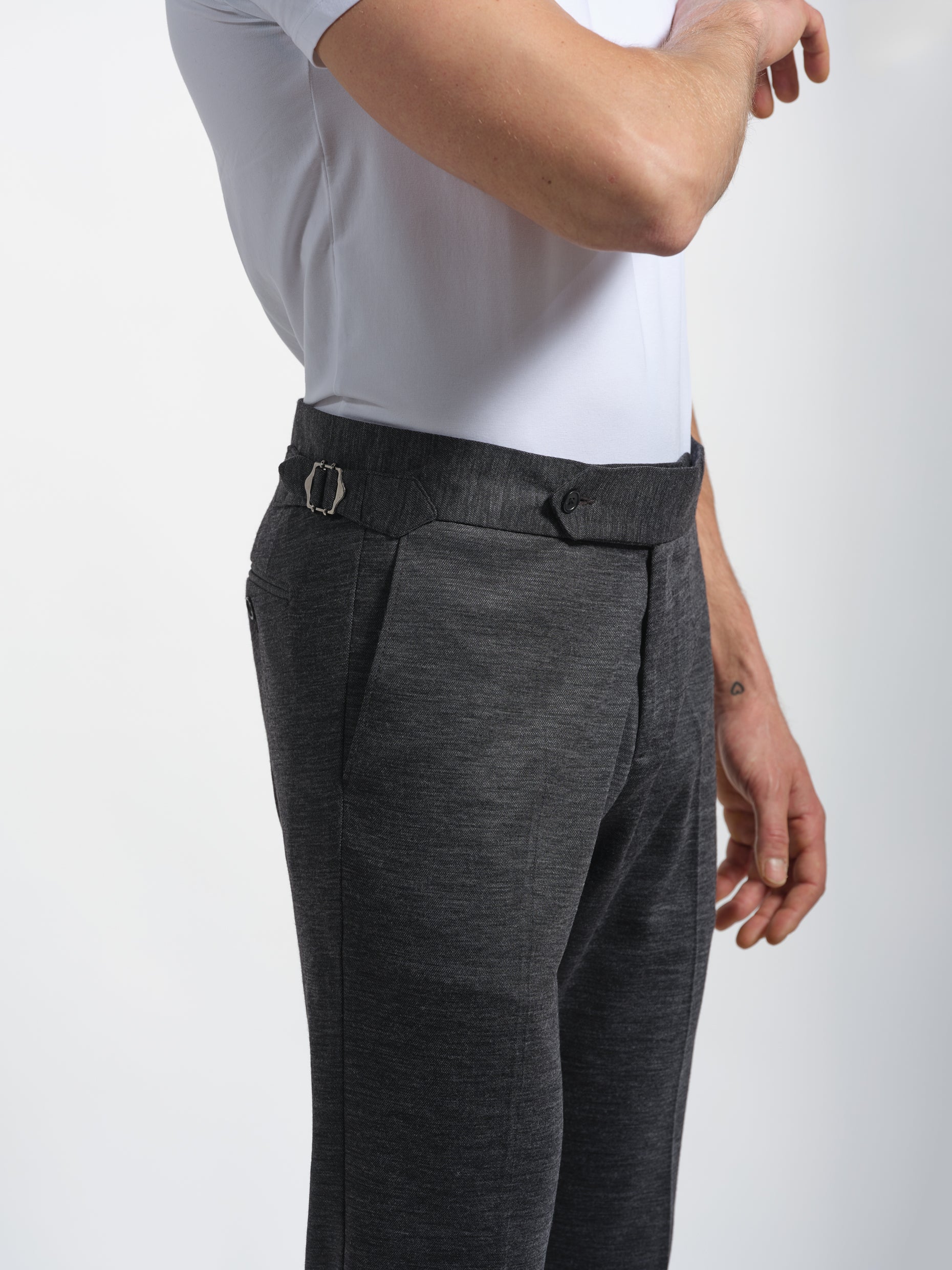 Person wearing dark gray pants london tabs and side tabs