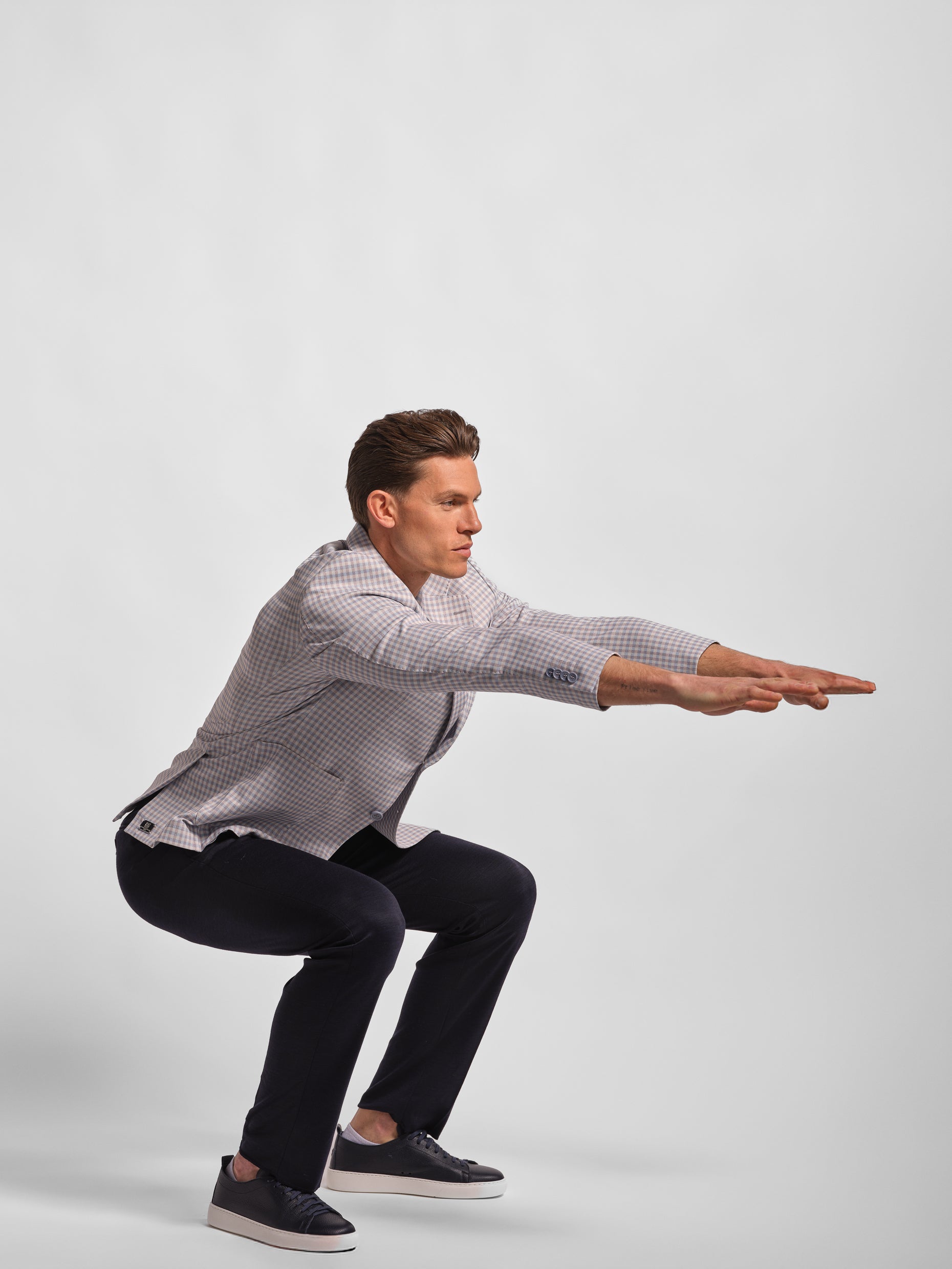 man stretching in Light blue small multi-check jersey blazer