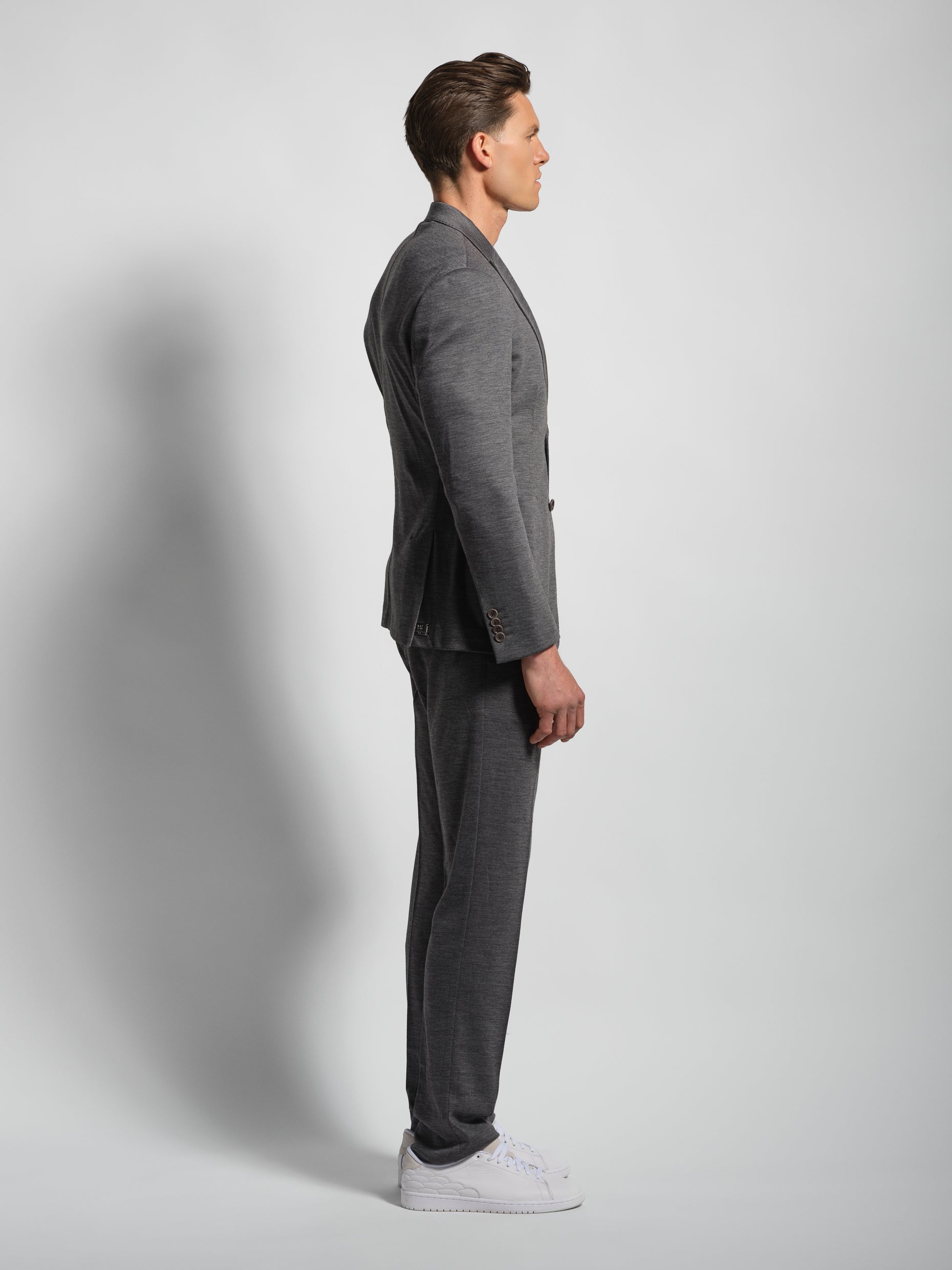Grey jersey stretch suit side view