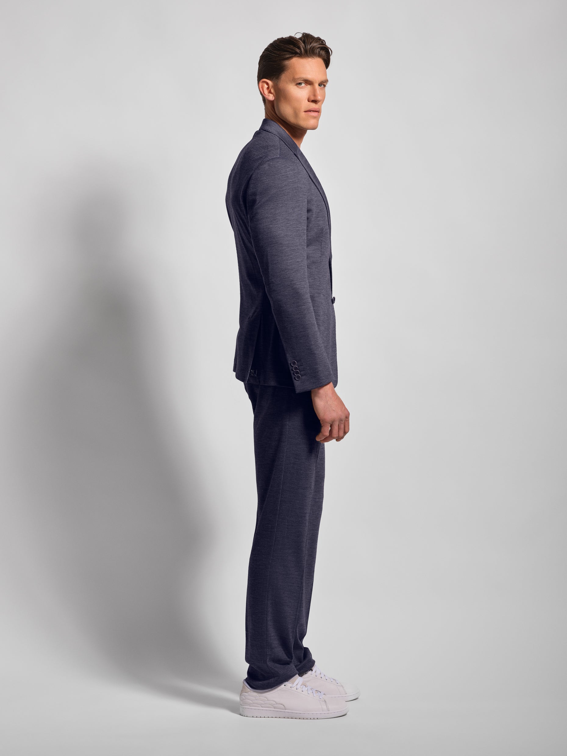 Blue jersey stretch suit side view