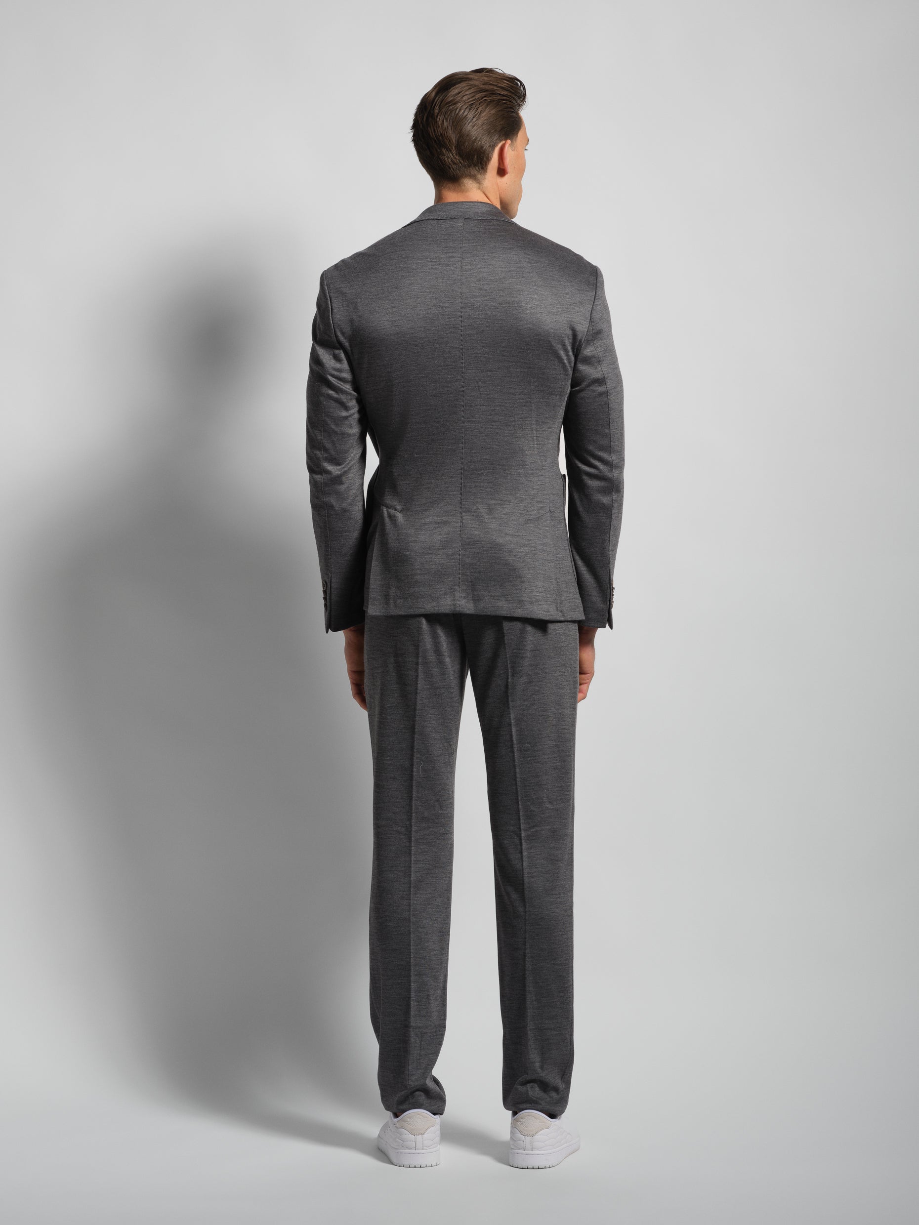 Grey jersey stretch suit back view