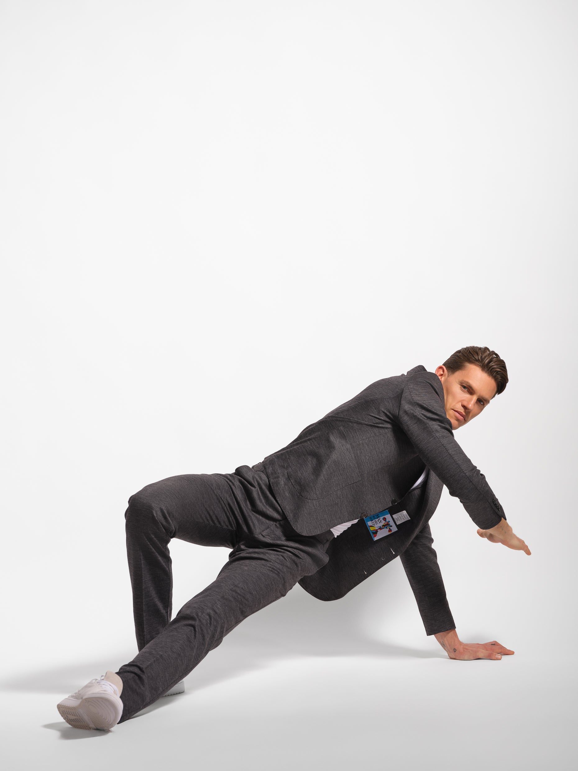 Charcoal grey jersey stretch suit being stretched