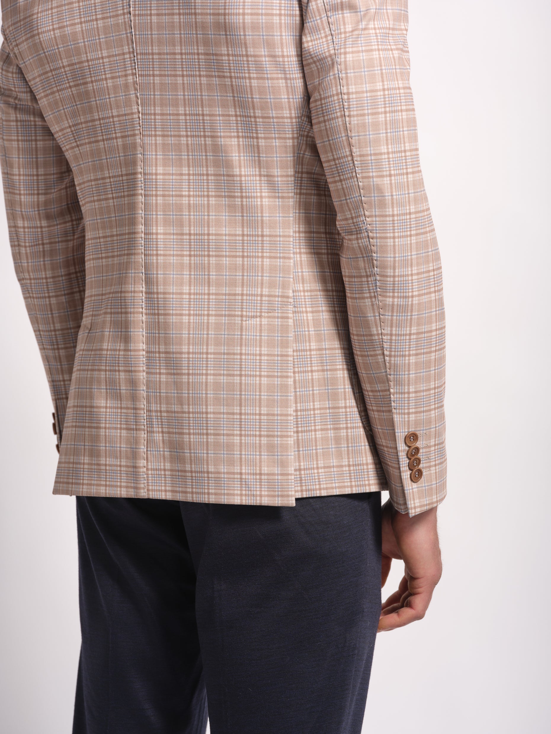 side view of a checkered jersey blazer side vent
