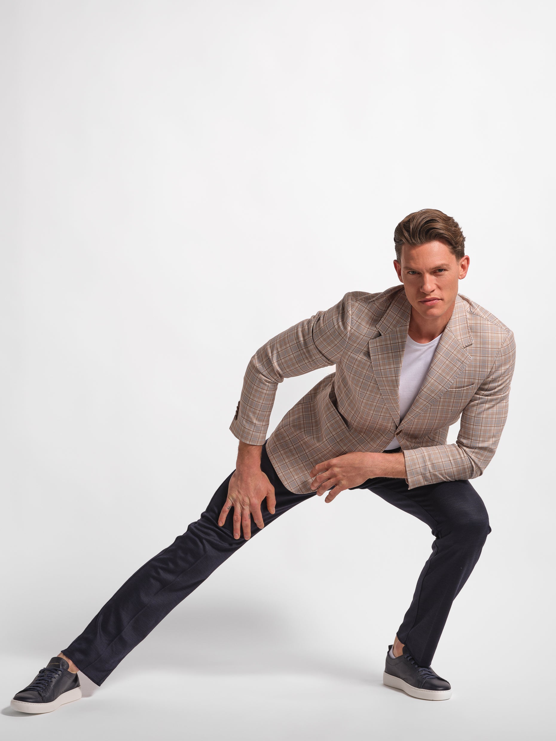 man stretching in wide check  jersey blazer front view