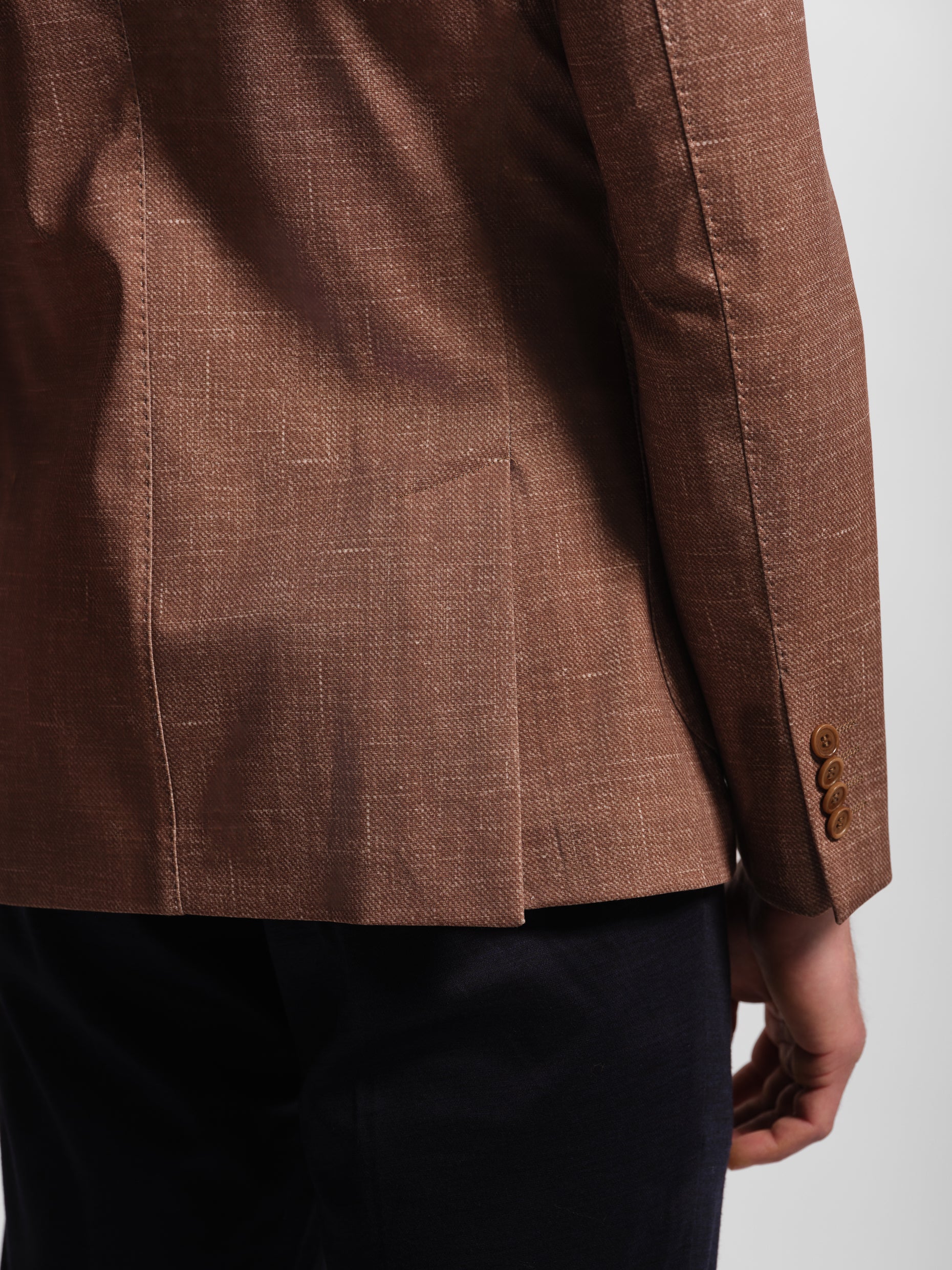 Brown suit jacket with a double vents