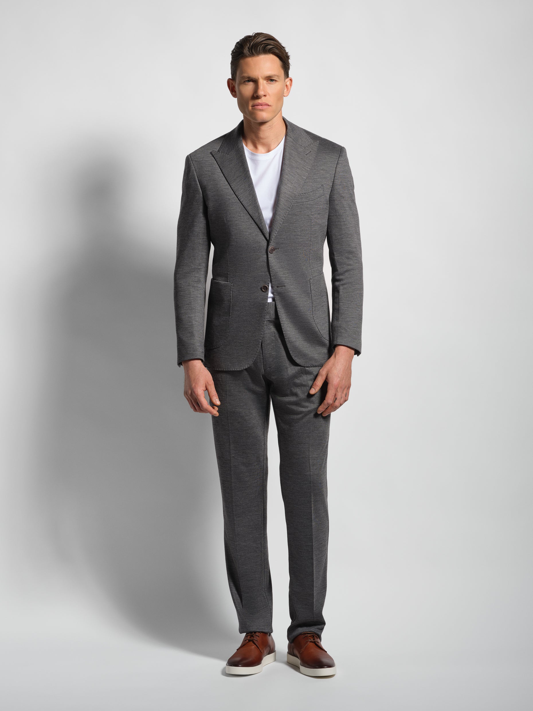 Grey jersey stretch suit front view  peak lapel