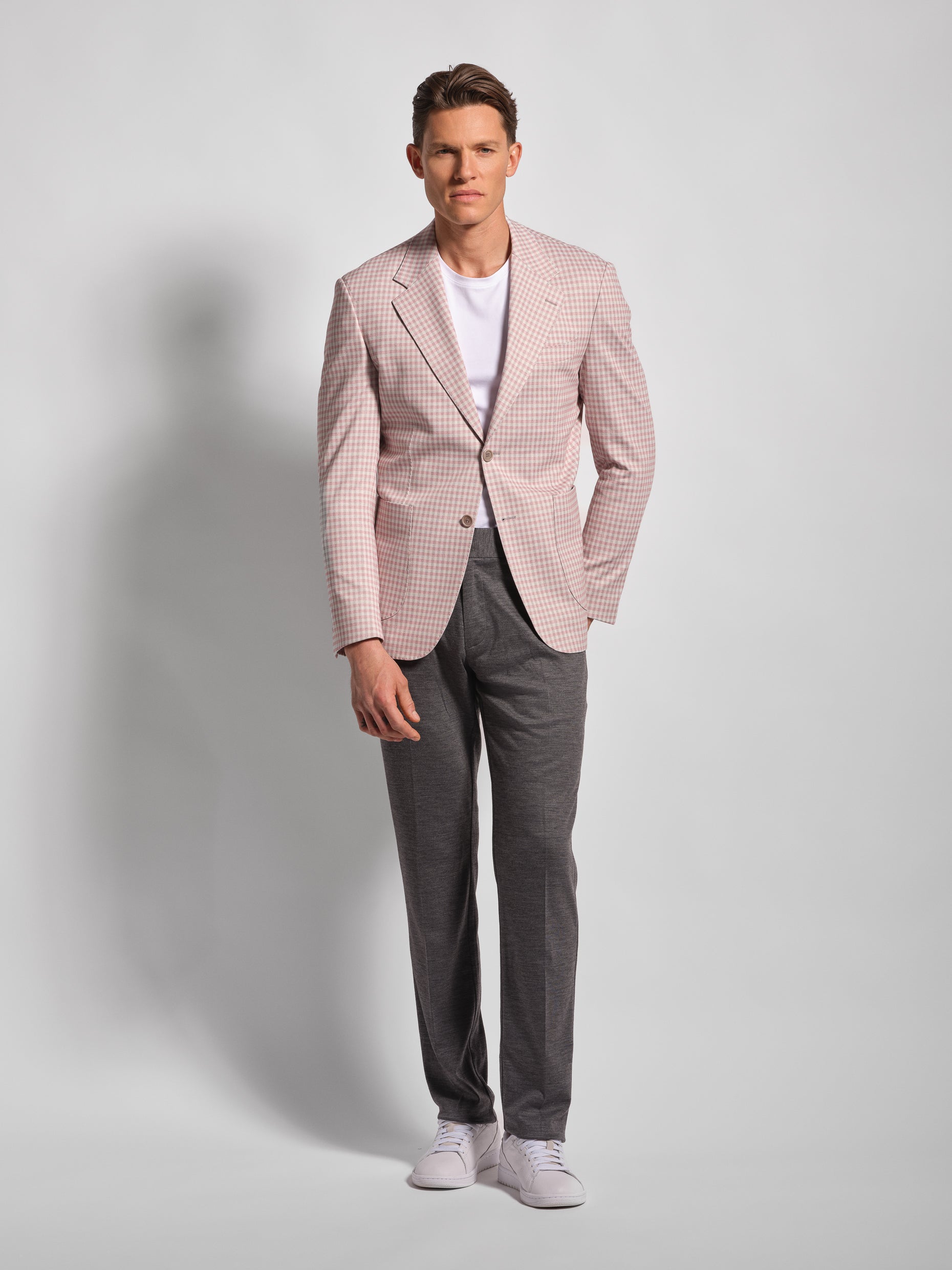 Man wearing a pink checkered blazer and gray pants Pink small multi-check stretch cotton blend jersey